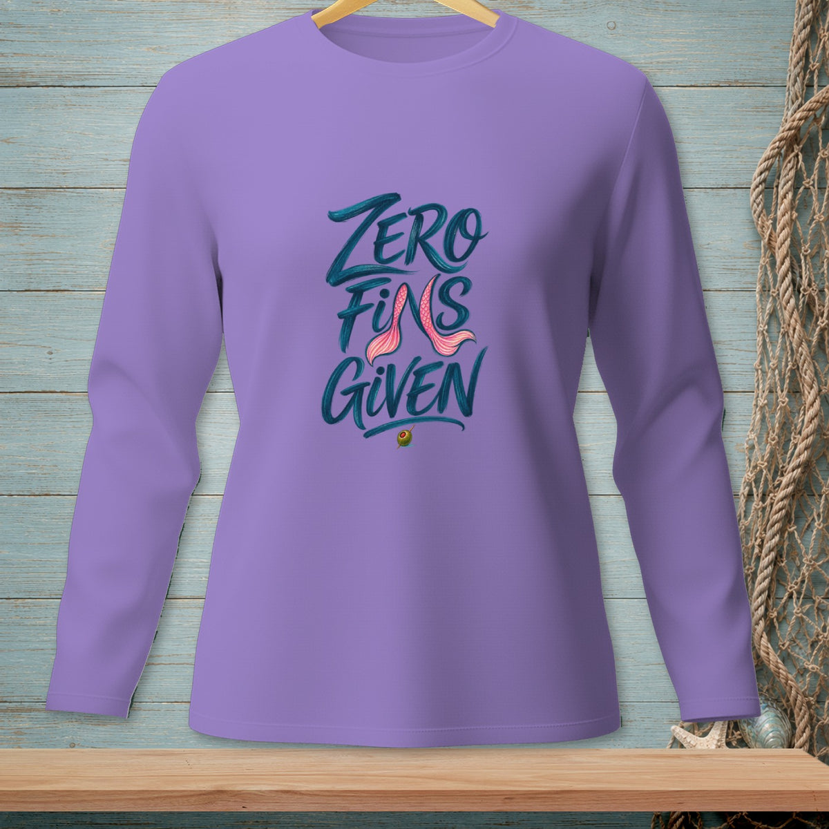 Lavender long sleeve shirt with "Zero Fins Given" text and mermaid tail graphic.