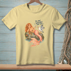 Yellow t-shirt with mermaid and seagull graphic that reads "I'm not available for this."