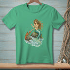 Mermaid holding pearl with lobster on rocks in swirling water on green t-shirt.