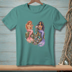 Two mermaids sit on rocks surrounded by beach trash, with one holding a pearl.