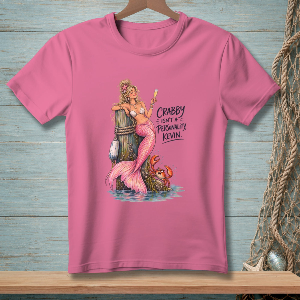 Pink t-shirt with mermaid, crab, and text "Crabby Isn't a Personality, Kevin."