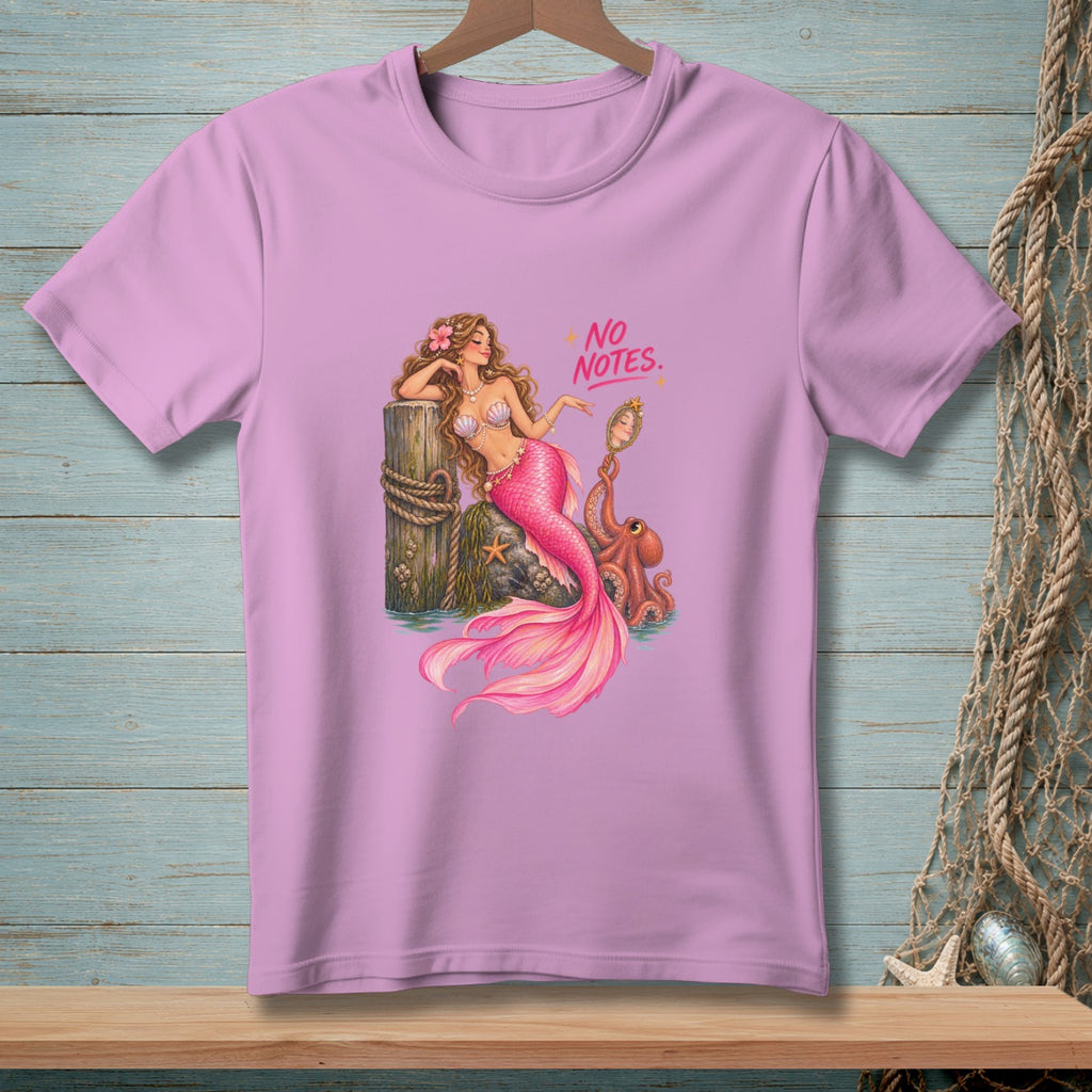 Pink t-shirt with a mermaid illustration holding a mirror with "NO NOTES." text.
