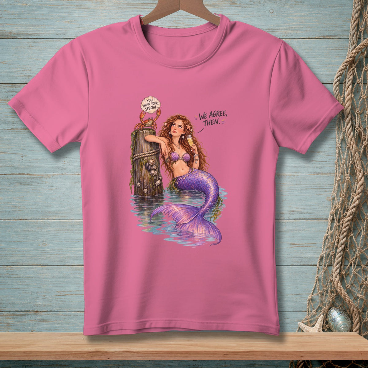 Mermaid with crab and text "We agree, then." on pink t-shirt.