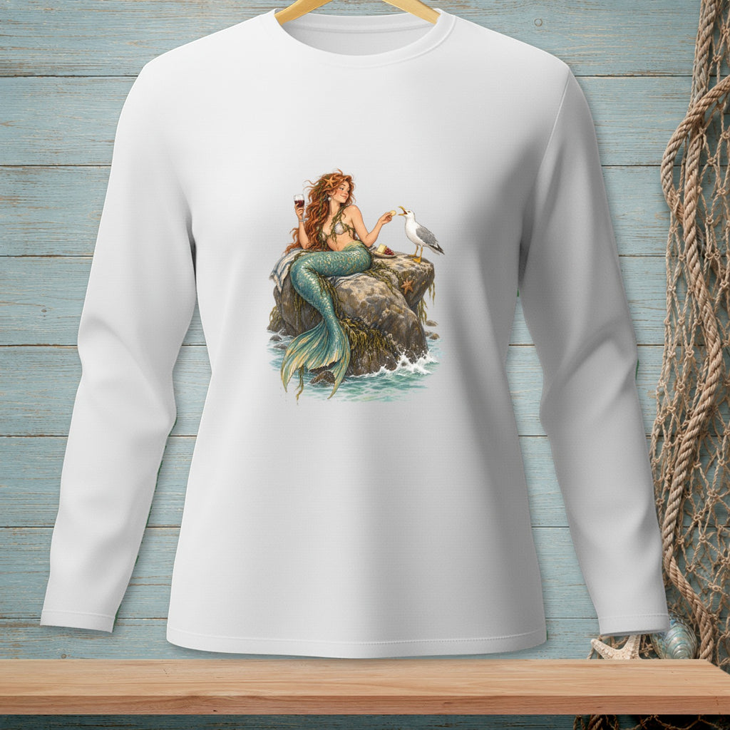 Mermaid with wine glass offers food to a seagull on a rock in the ocean.