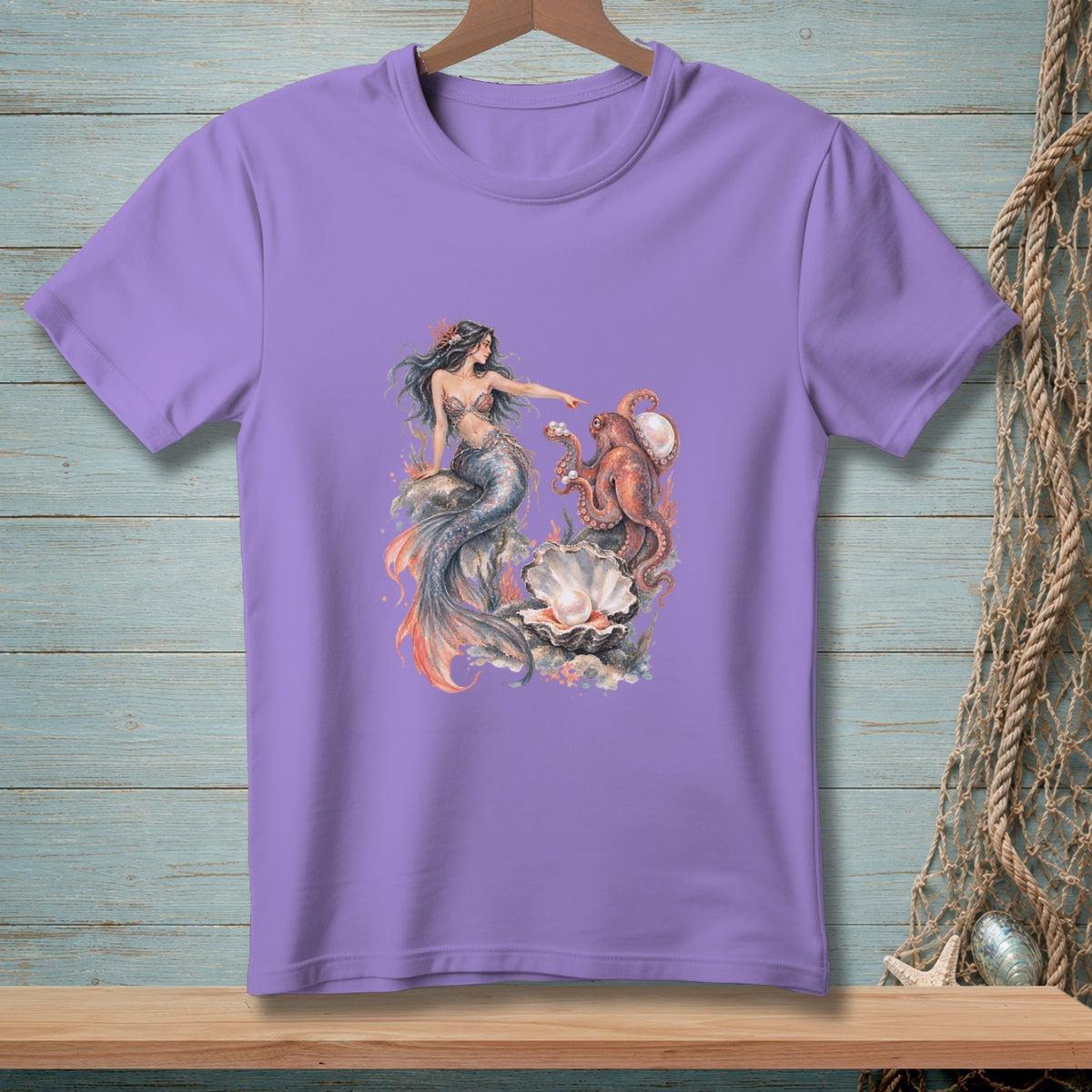 Purple t-shirt with a watercolor graphic of a mermaid pointing at an octopus near a giant clam.
