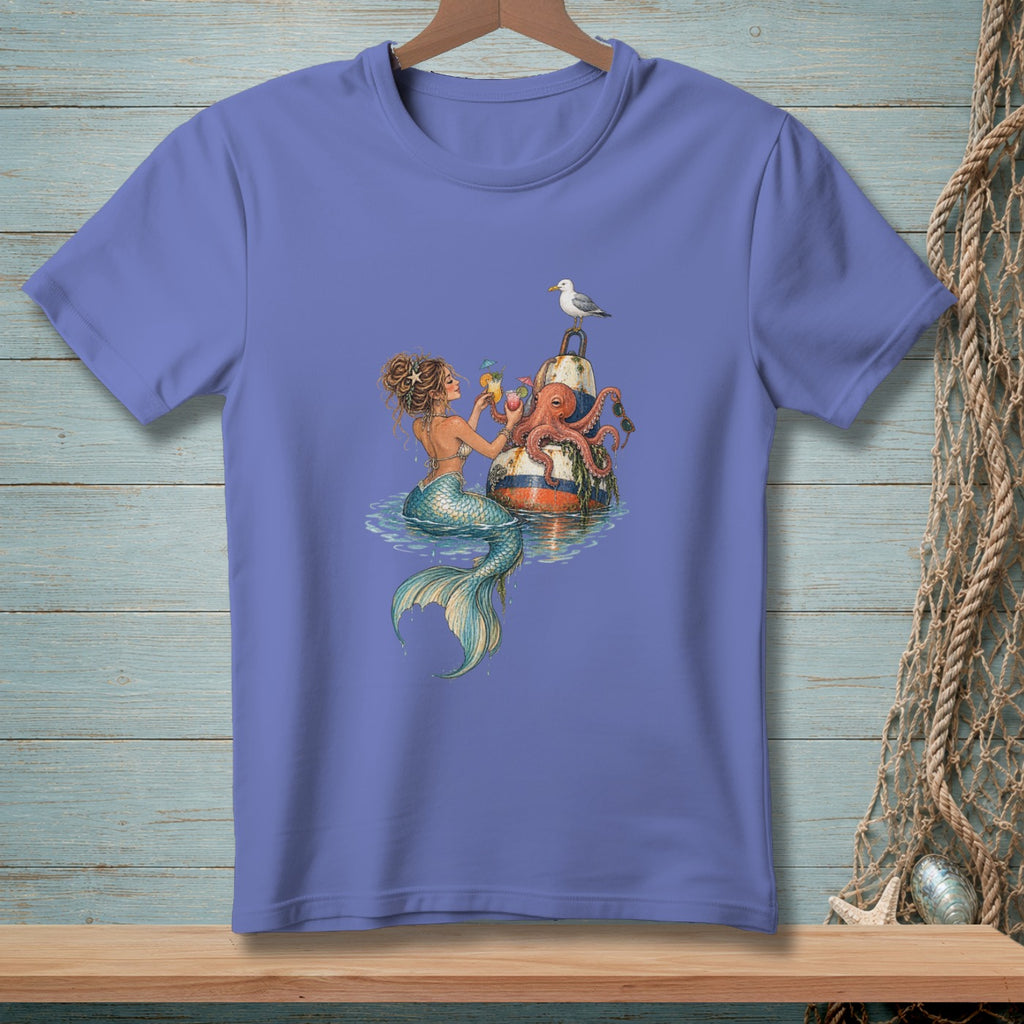 Mermaid and octopus on a buoy with a seagull, holding drinks by the water.