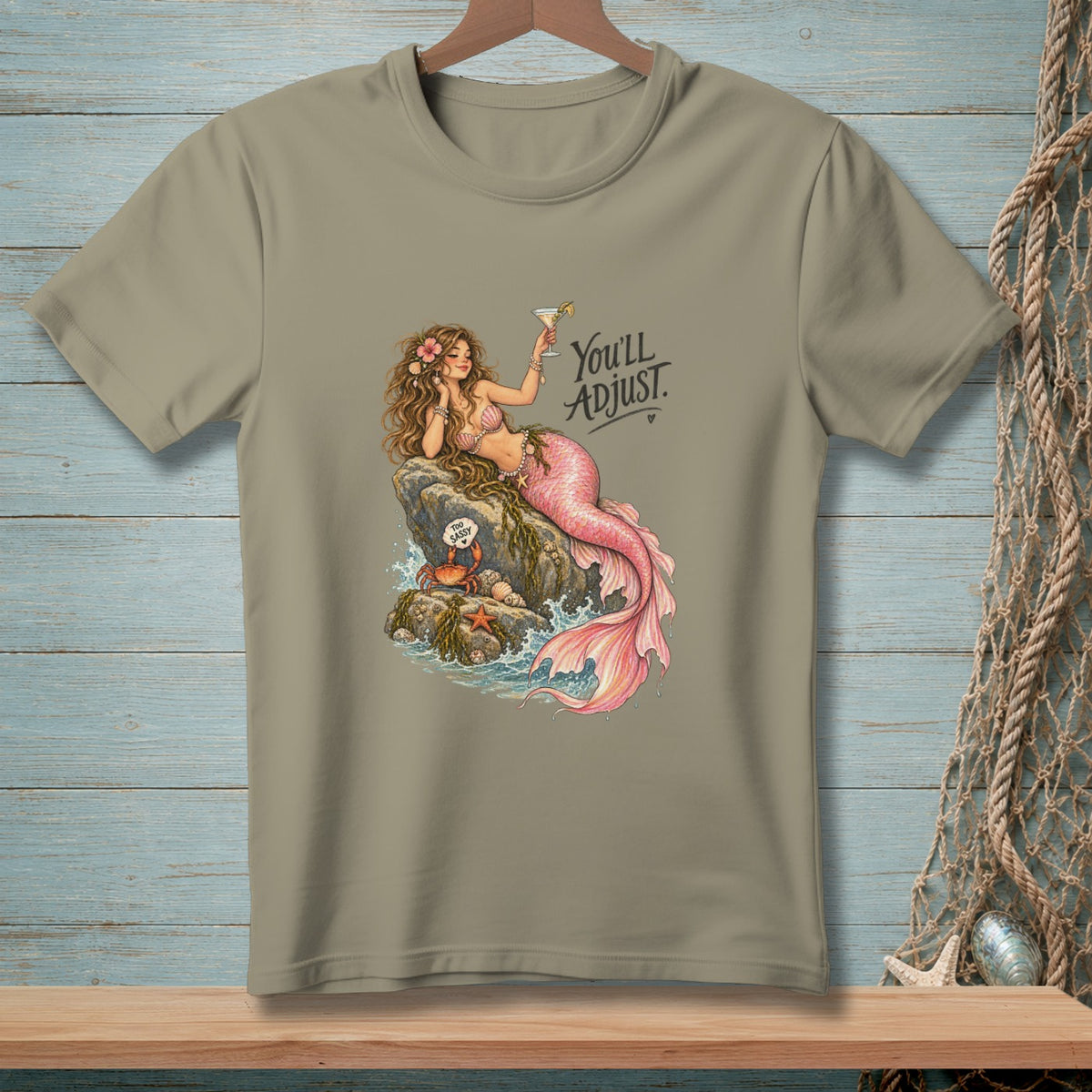 T-shirt with a mermaid drinking a martini, text reads "You'll ADJUST".
