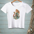 White t-shirt with a print of a mermaid, lobster, and crab by the sea.