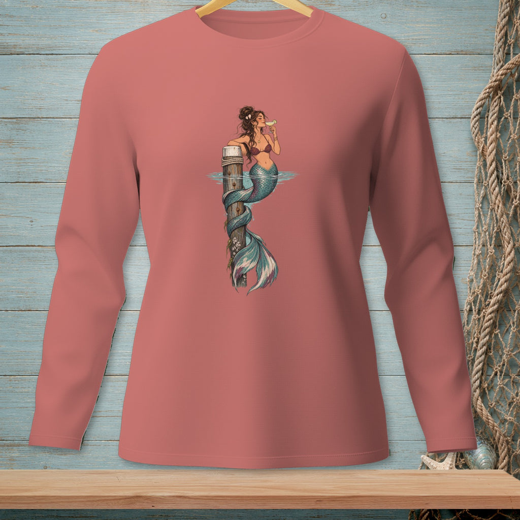 Mermaid with drink on pier, print on pink long-sleeved shirt.