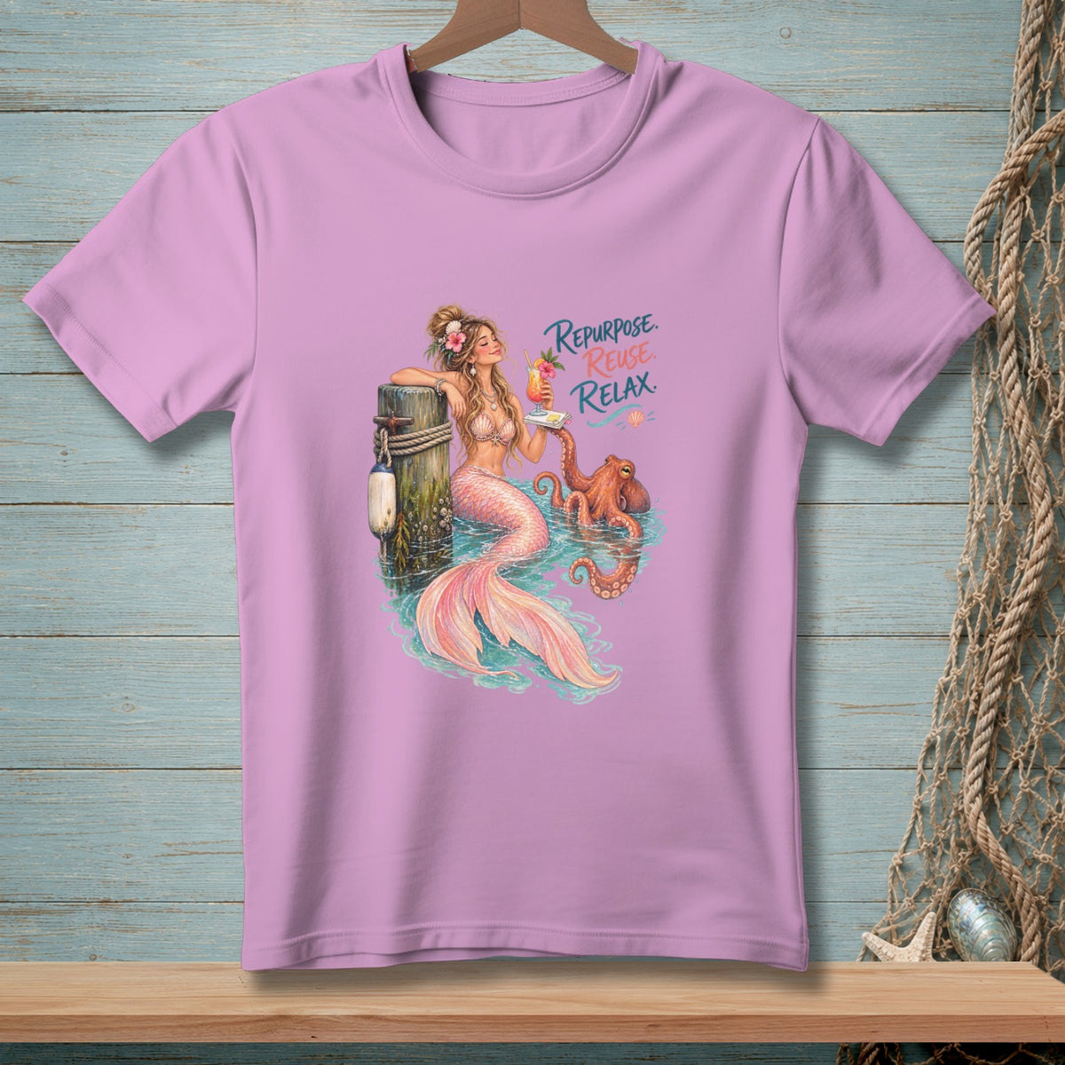 Pink t-shirt with mermaid and octopus graphic and text "Repurpose. Reuse. Relax."