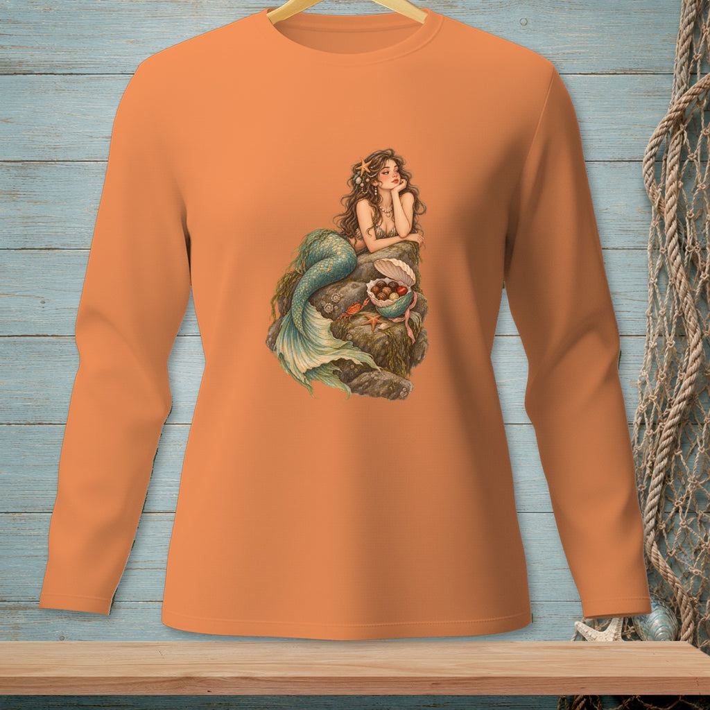 Long-sleeve orange t-shirt with a mermaid graphic on a rock.