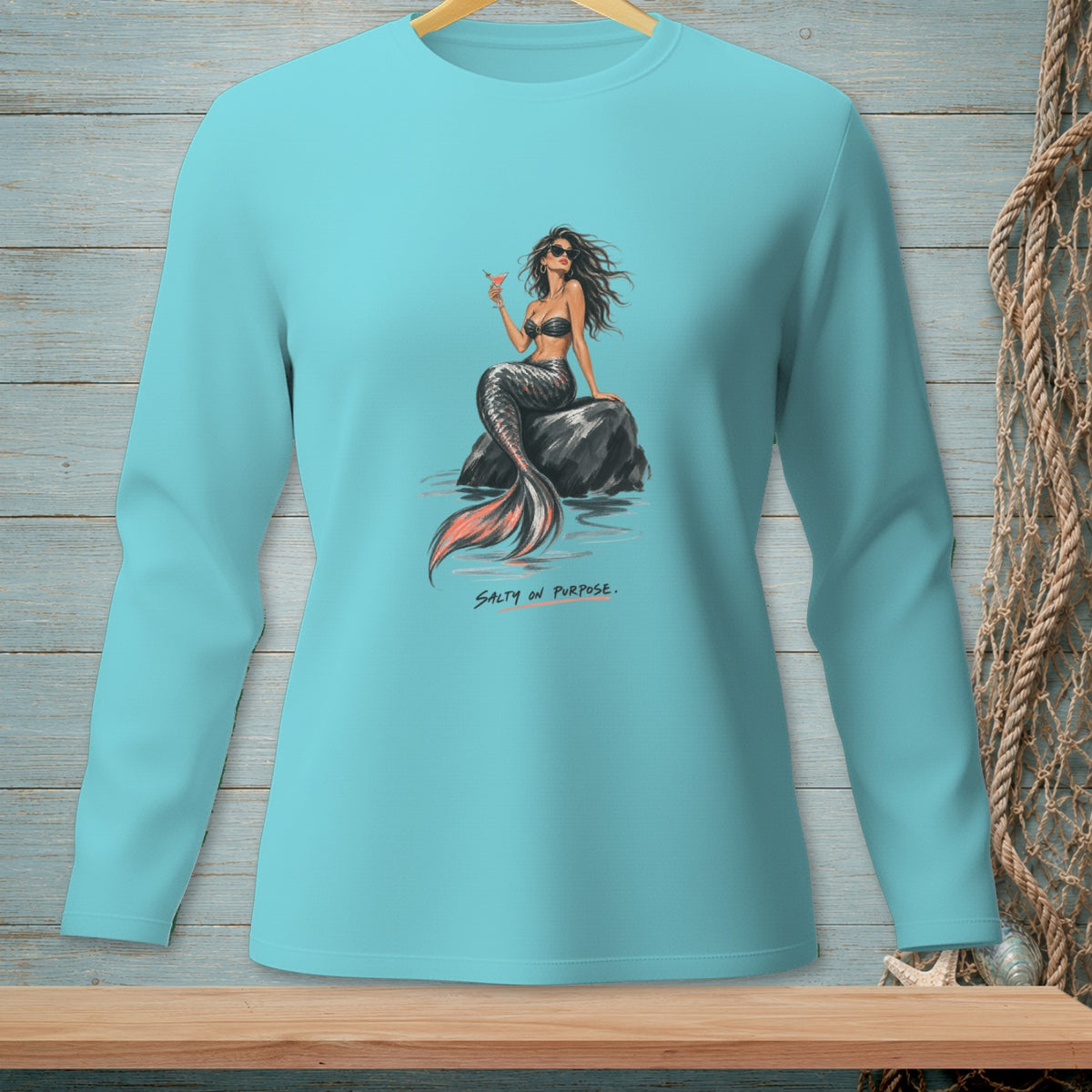 Teal long-sleeve shirt with mermaid and text "Salty on Purpose".