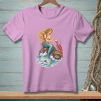 Pink t-shirt with a graphic of a mermaid holding a pearl next to a lobster.