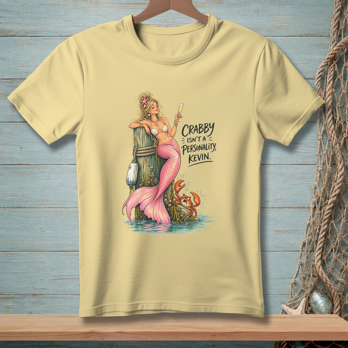 Yellow t-shirt featuring a mermaid and crab with the text "Crabby Isn't A Personality, Kevin."