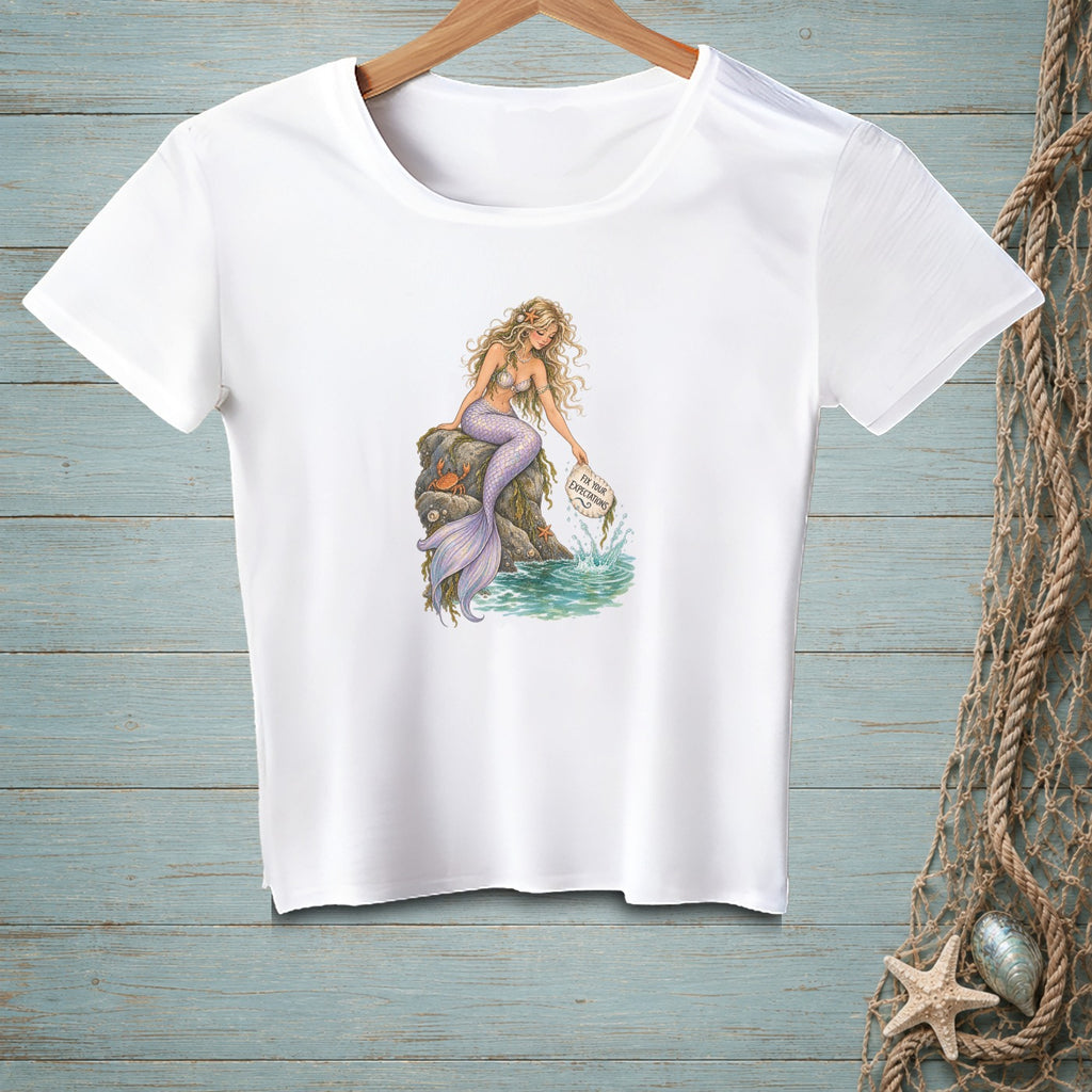 White t-shirt with mermaid on rock holding sign "Fix Your Expectations".