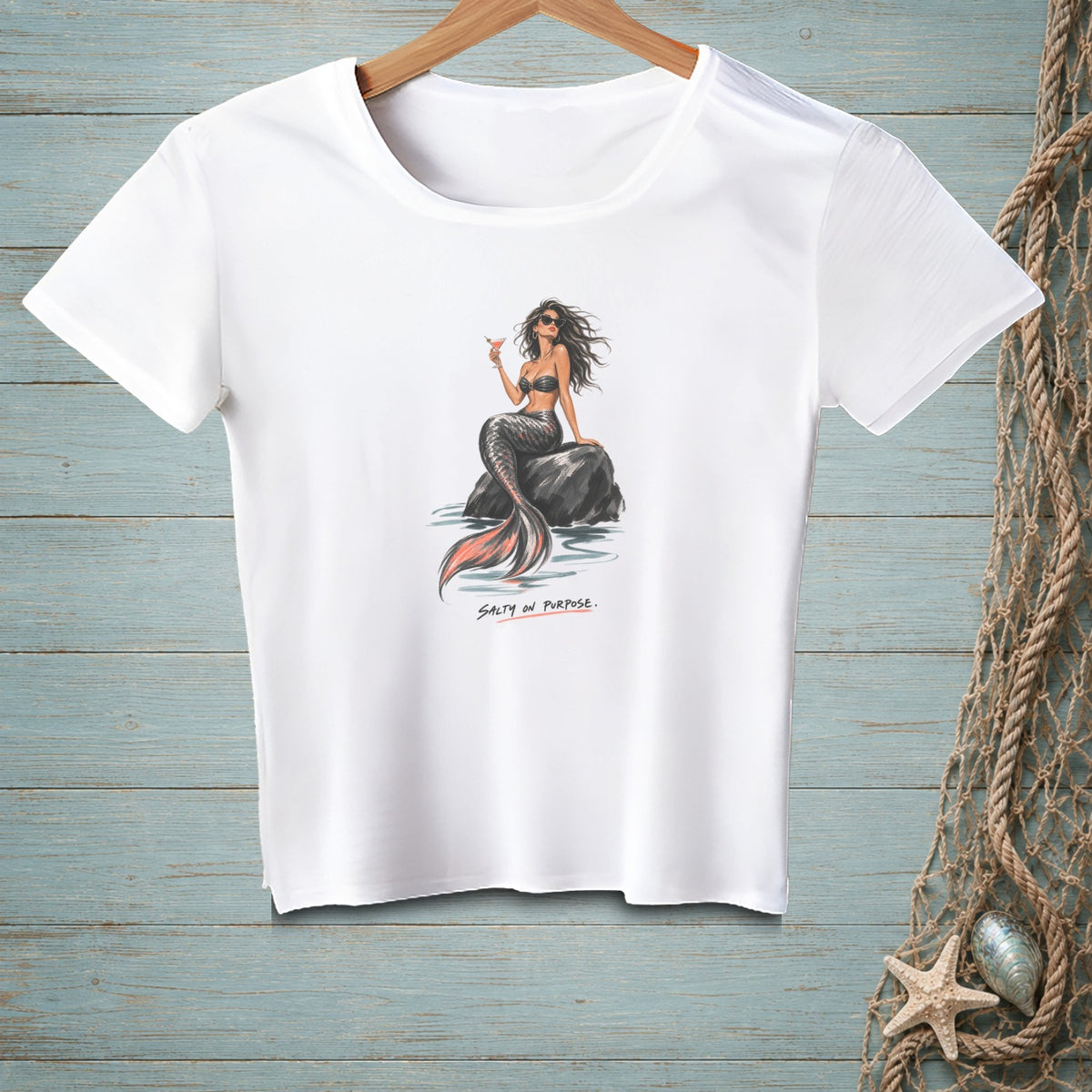 White t-shirt with a mermaid illustration and text "SALTY ON PURPOSE."