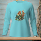 Turquoise long-sleeve shirt with mermaid, octopus, and shell graphic on rock.