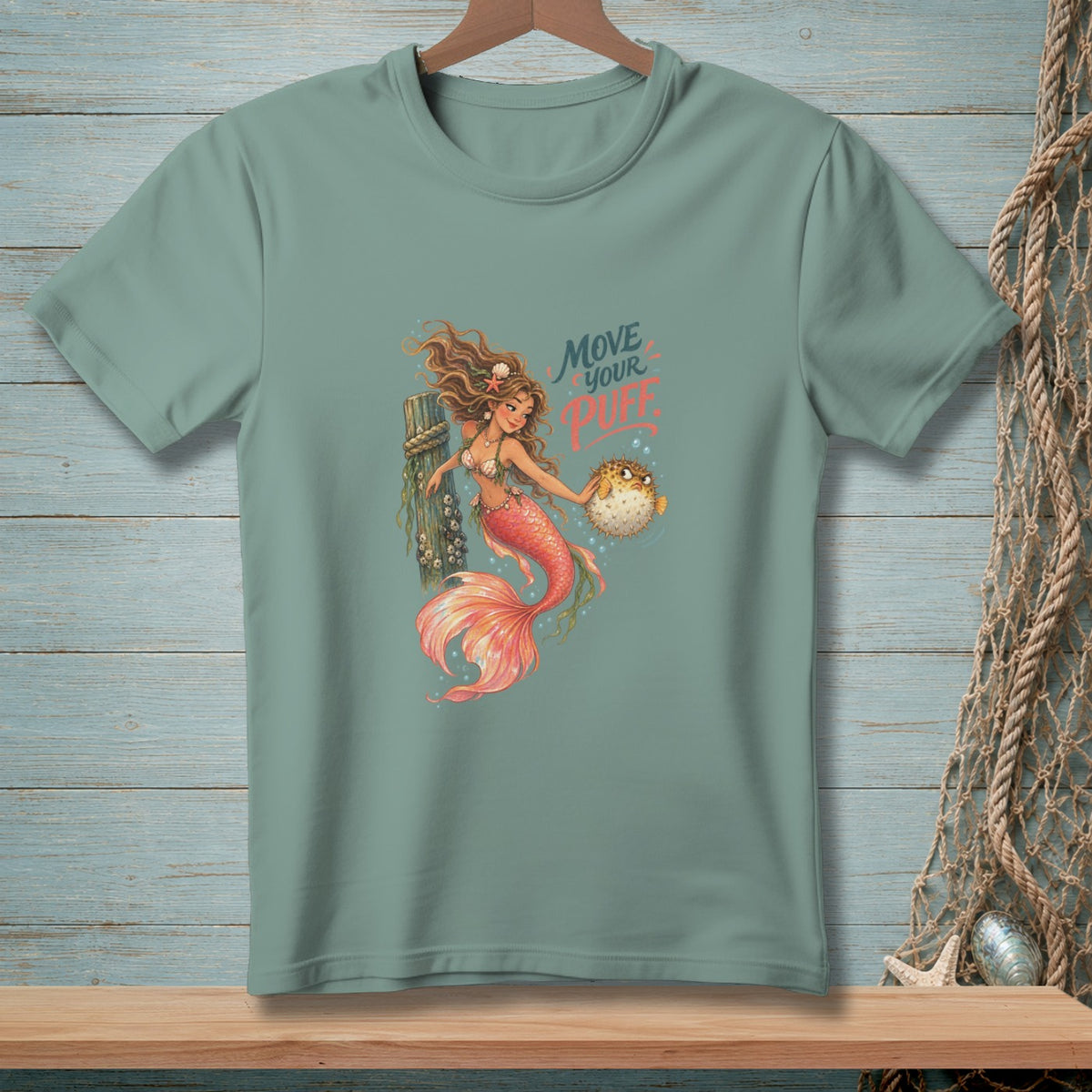 Green t-shirt with a mermaid holding a pufferfish and the text "Move Your Puff".