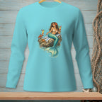 Long-sleeved teal shirt with a graphic of a mermaid holding cocktails on a rock.