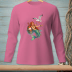 Pink long-sleeve shirt with a mermaid and seagull illustration.