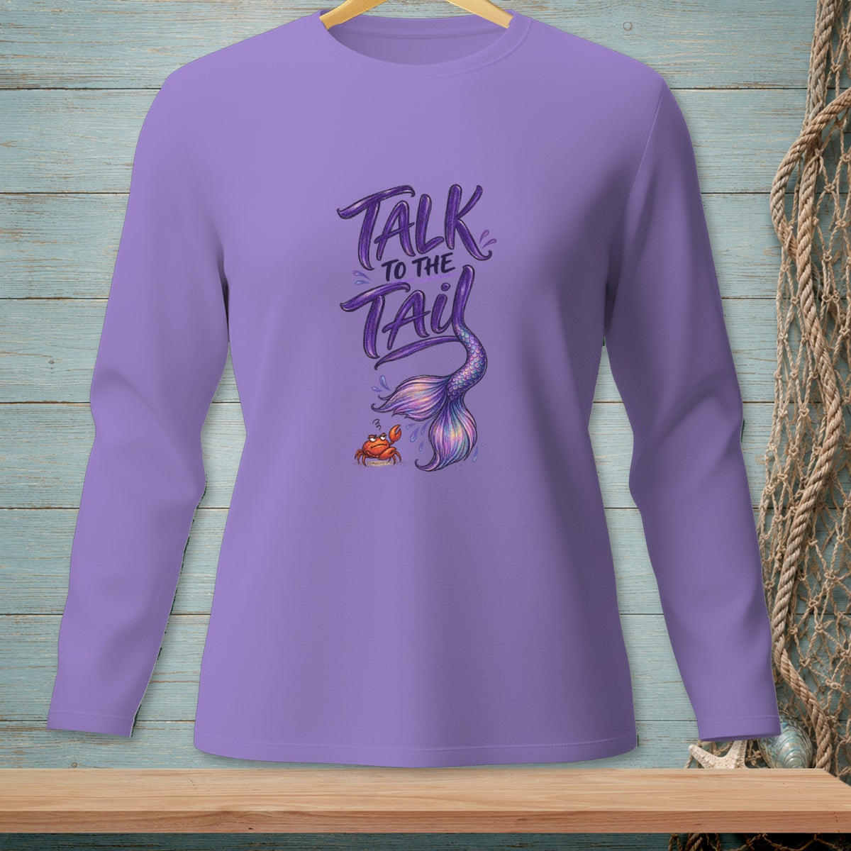 Purple long sleeve shirt with "Talk to the Tail" text and mermaid tail graphic.