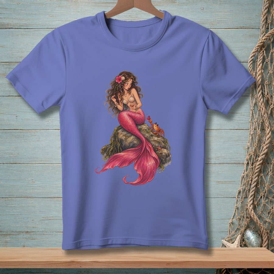 Periwinkle t-shirt with a graphic of a mermaid sitting on a rock with a crab.