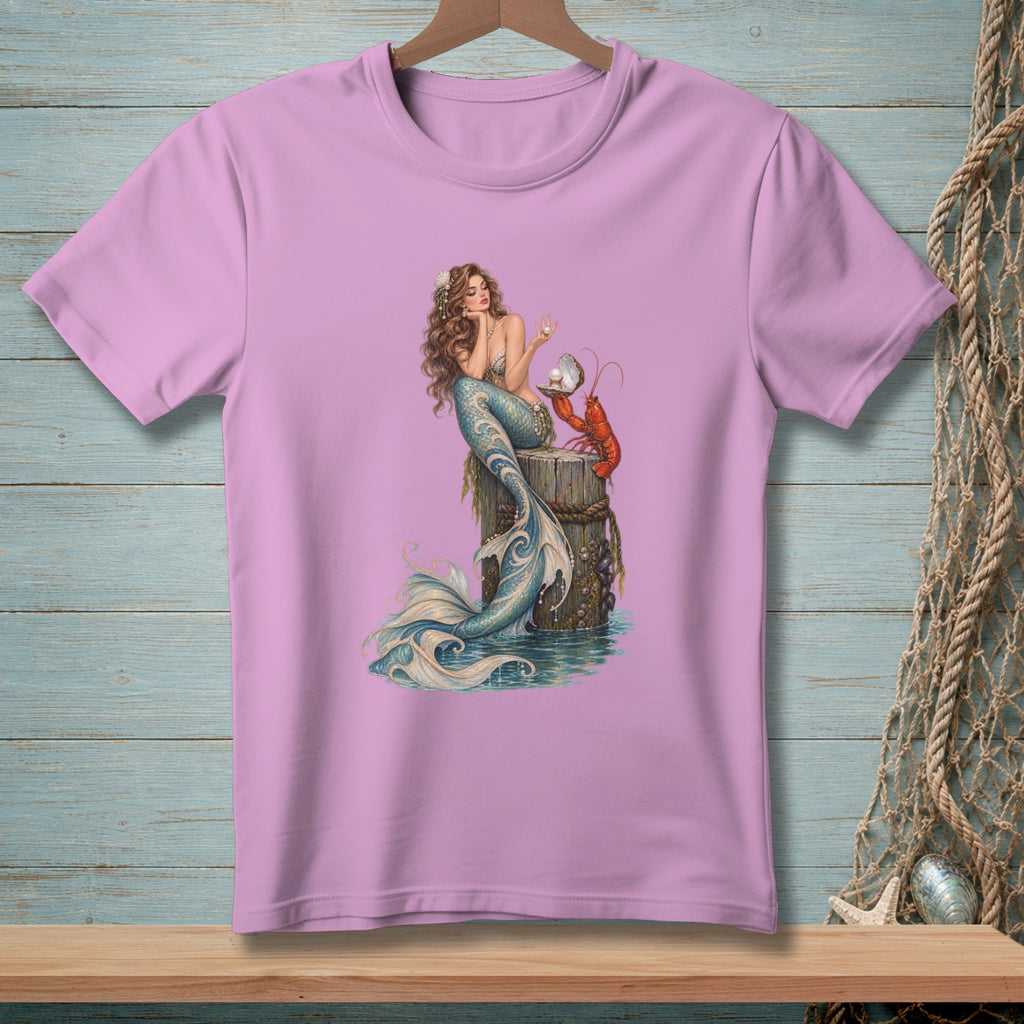 Pink t-shirt with illustration of a mermaid holding a pearl next to a lobster.
