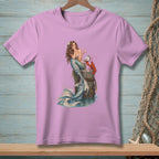 Pink t-shirt with illustration of a mermaid holding a pearl next to a lobster.
