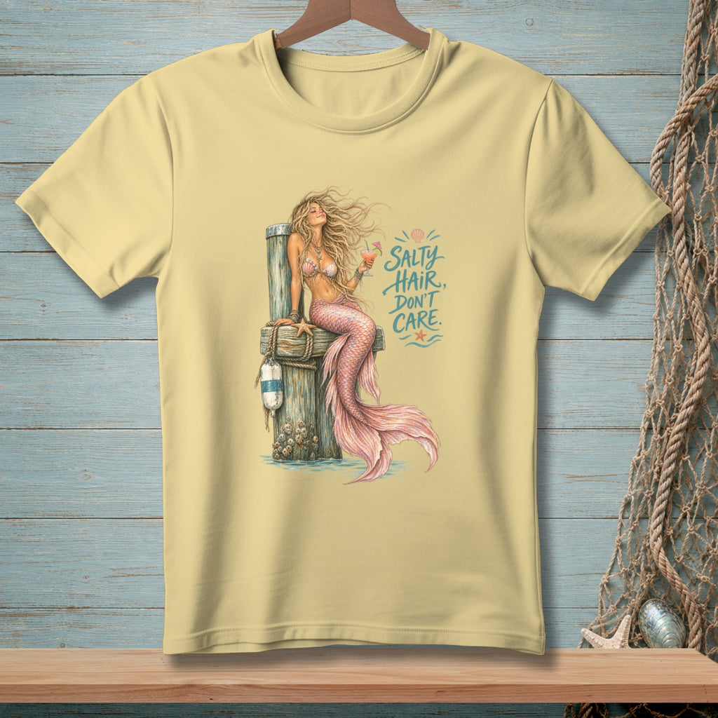 Pale yellow t-shirt with a mermaid illustration and the text "Salty Hair, Don't Care."