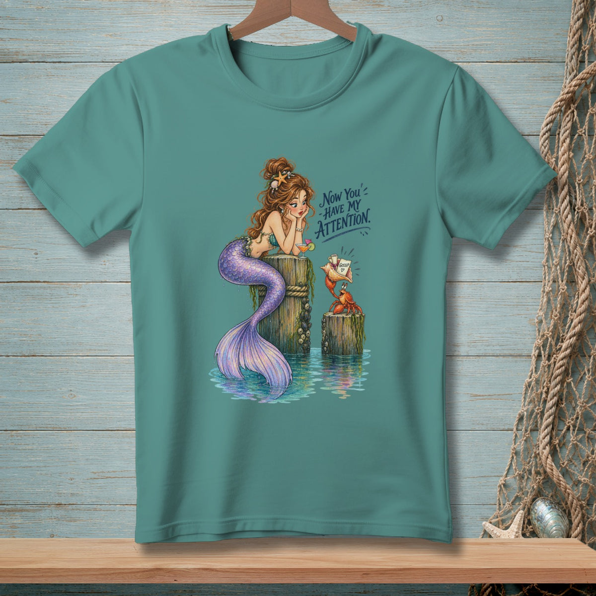 Mermaid and crab on posts with text "Now You Have My Attention."