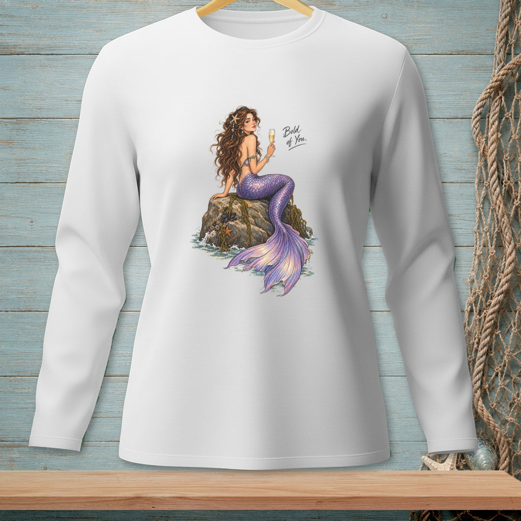 White long-sleeve shirt with a mermaid illustration holding champagne, reading "Bold of You."