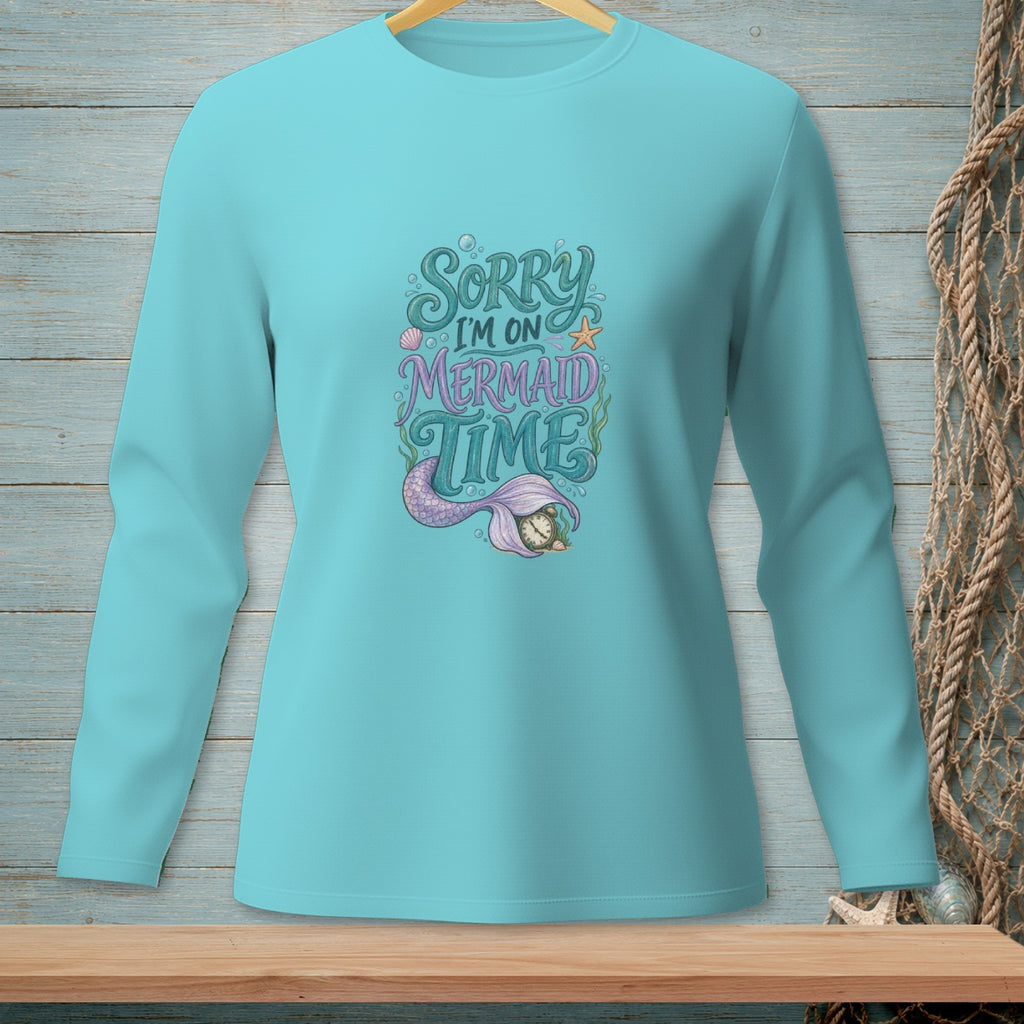 Long sleeve aqua shirt with "Sorry I'm on Mermaid Time" text and mermaid tail graphic.