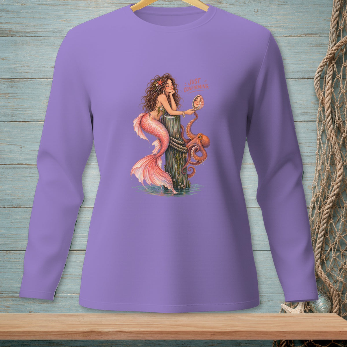 Mermaid and octopus illustration with text "JUST CONFIRMING" on a purple shirt.