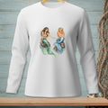 Two mermaids with green and blue tails sitting on rocks.