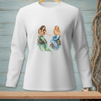 Two mermaids with green and blue tails sitting on rocks.