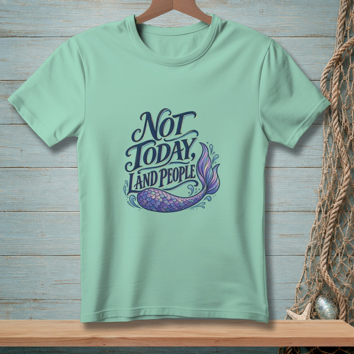 Mint t-shirt with text "Not Today, Land People" and mermaid tail graphic.