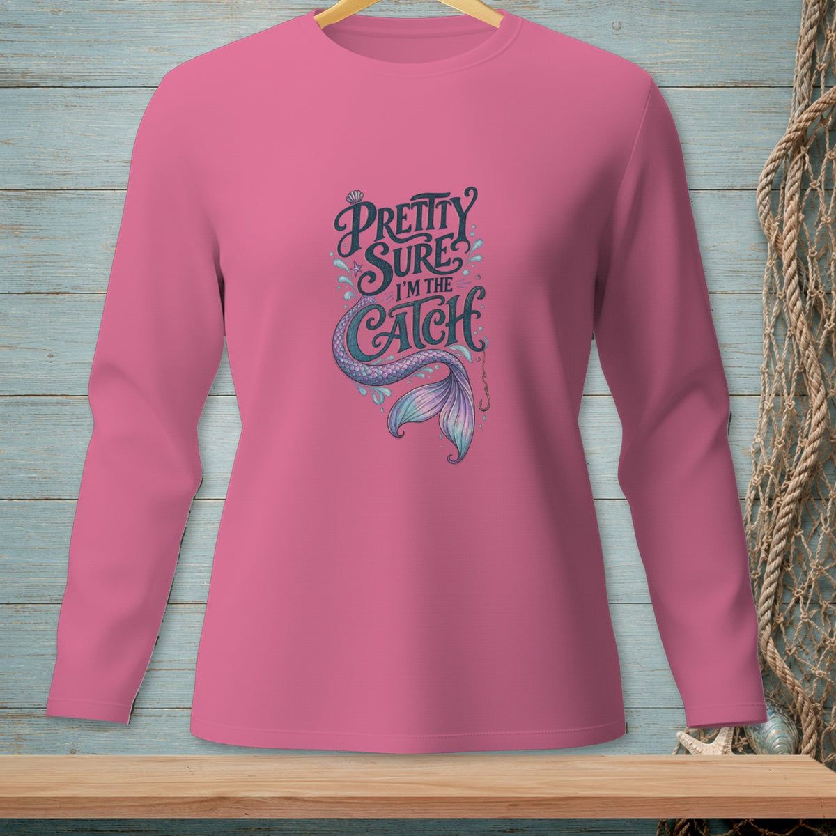 Pink long-sleeve shirt with "Pretty Sure I'm the Catch" mermaid graphic.