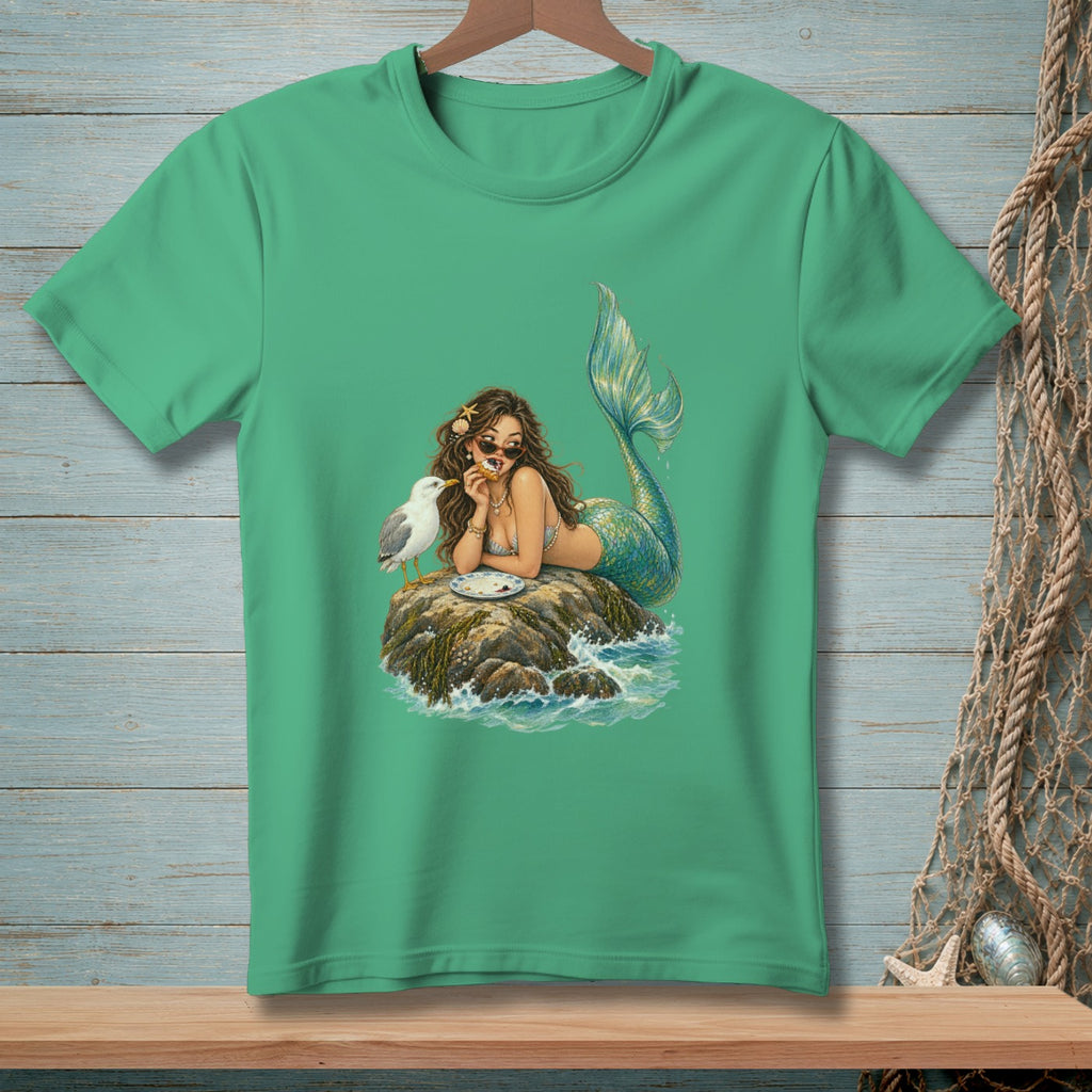 Mermaid on rock with seagull eating, on green t-shirt.