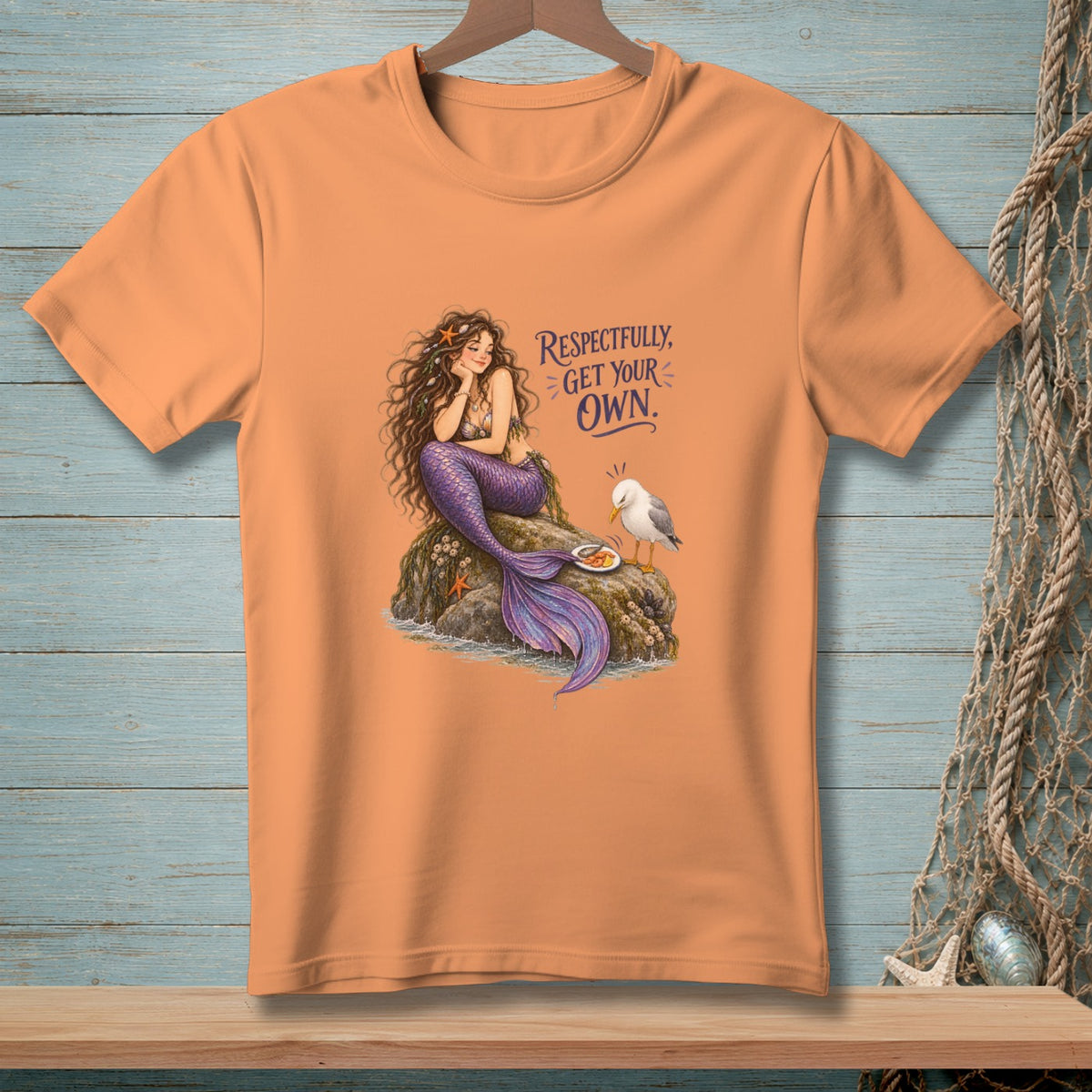 Orange t-shirt with a mermaid and seagull design and text "Respectfully, Get Your Own."