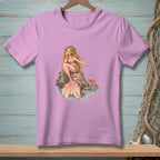 Pink t-shirt with illustration of a blonde mermaid sitting on rocks with a crab nearby.