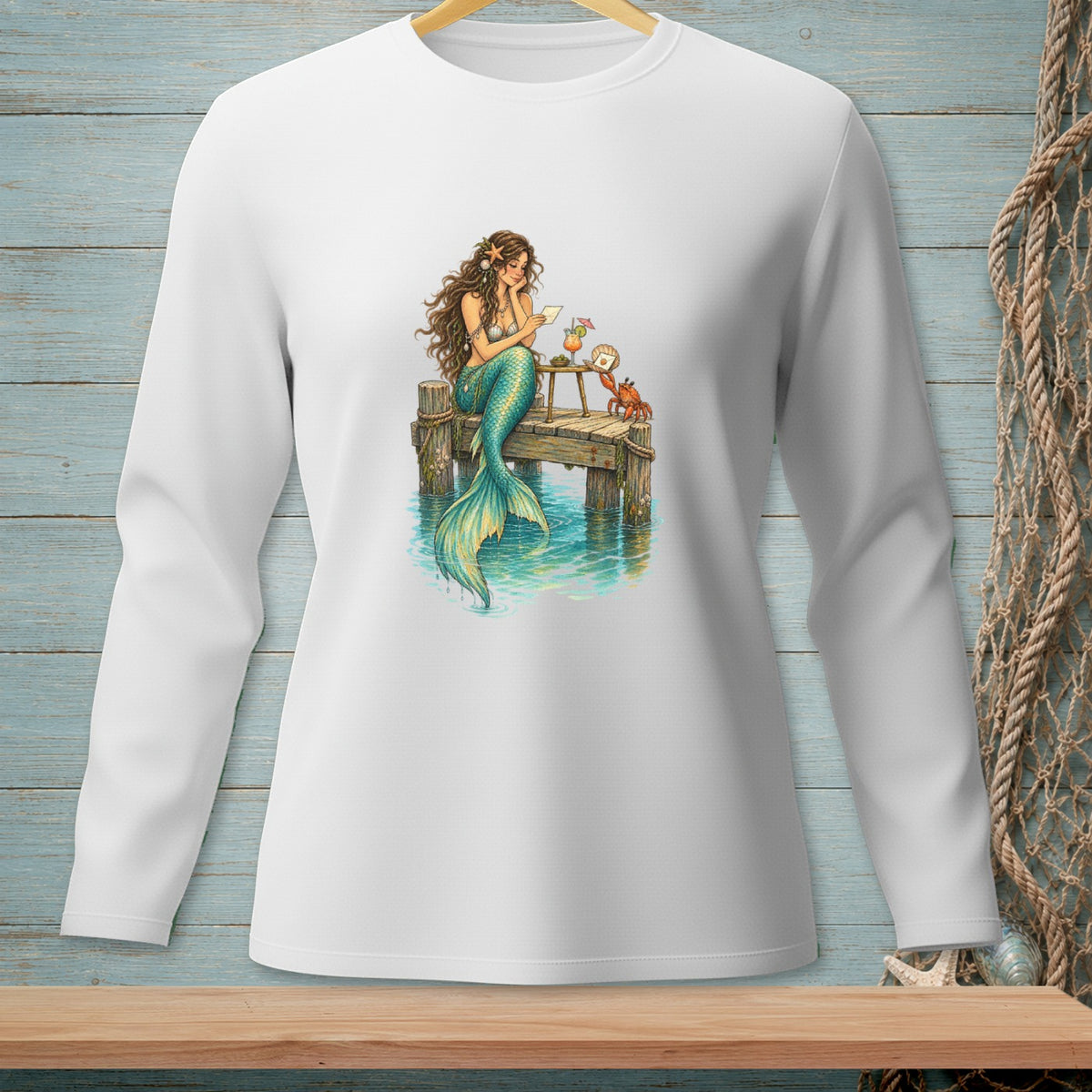 Mermaid reading a letter on a pier with a crab and drink.