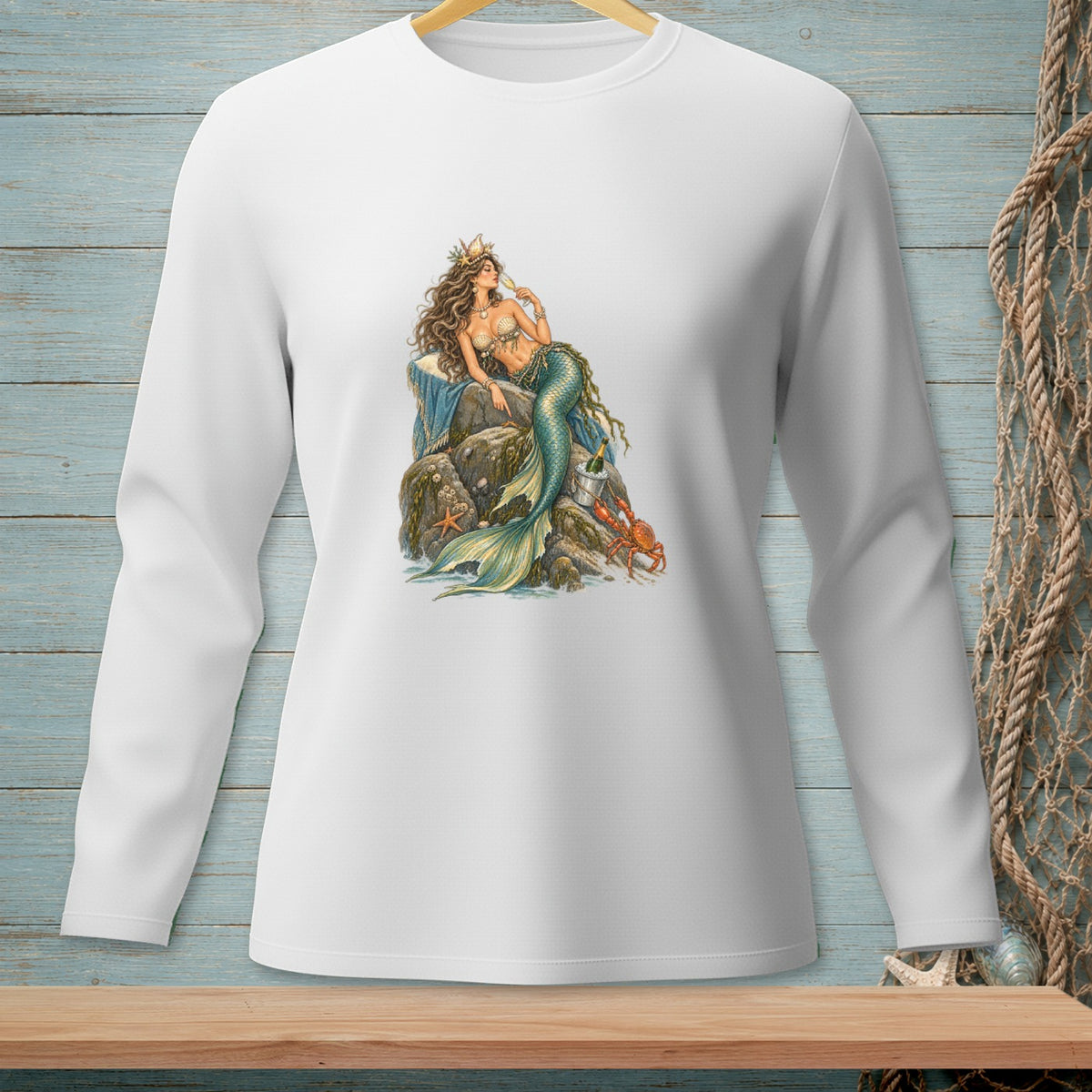 White long-sleeve shirt with a detailed mermaid sitting on rocks, drinking champagne.