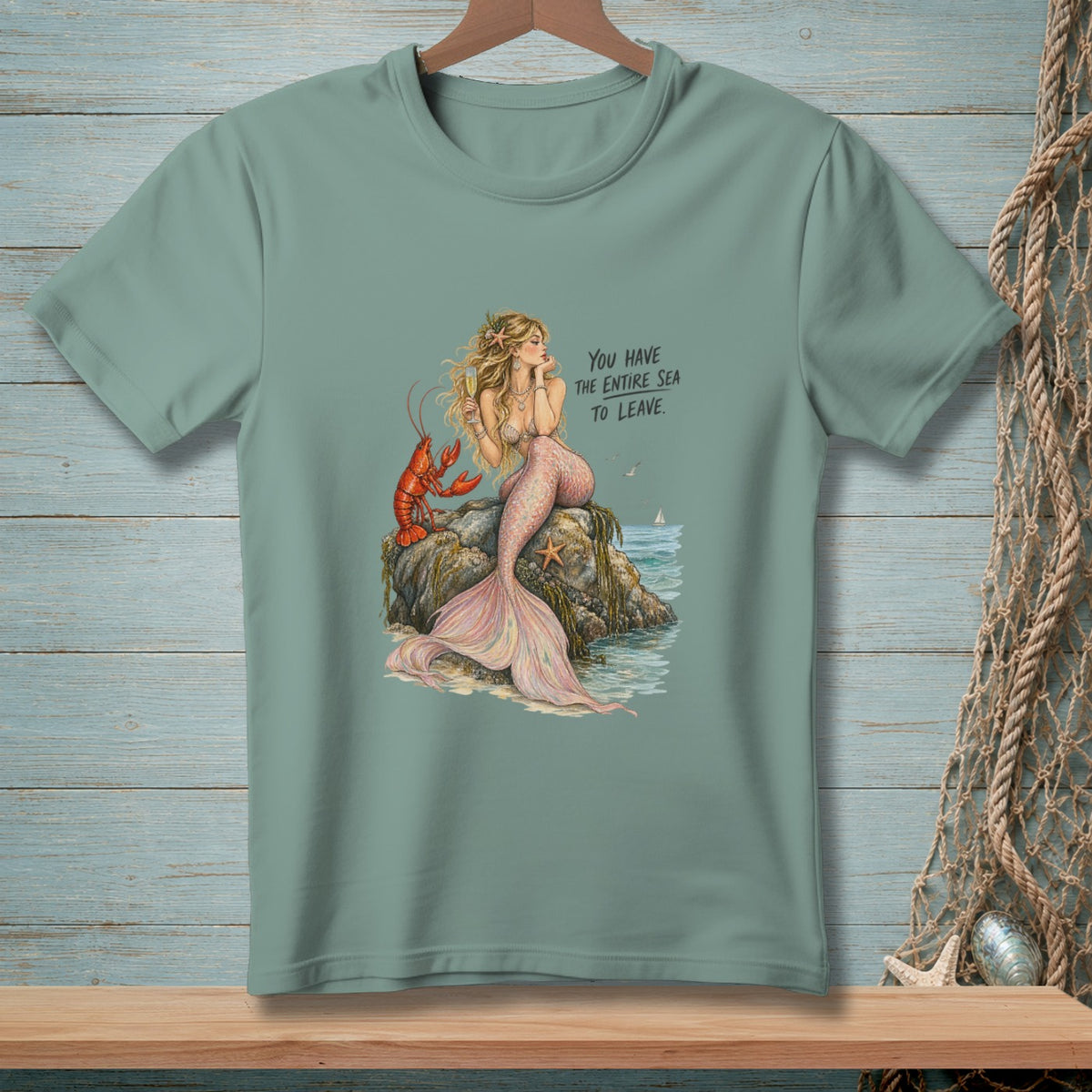 Mermaid with lobster on a rock, text "You have the entire sea to leave."