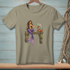Mermaid with purple tail sits on dock, interacting with a crab holding a fan.