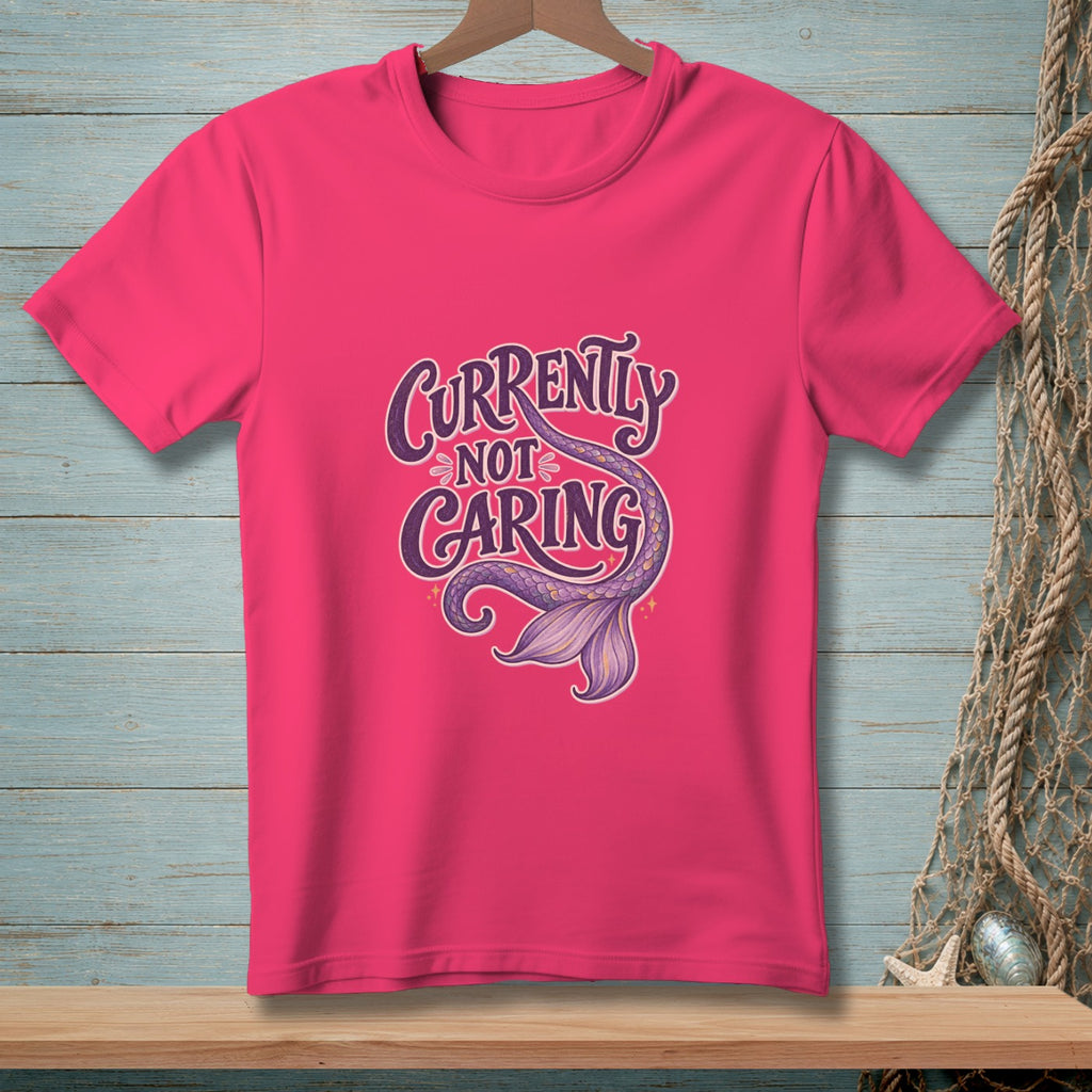 Pink t-shirt with purple text "Currently Not Caring" and a mermaid tail.