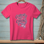 Pink t-shirt with purple text "Currently Not Caring" and a mermaid tail.