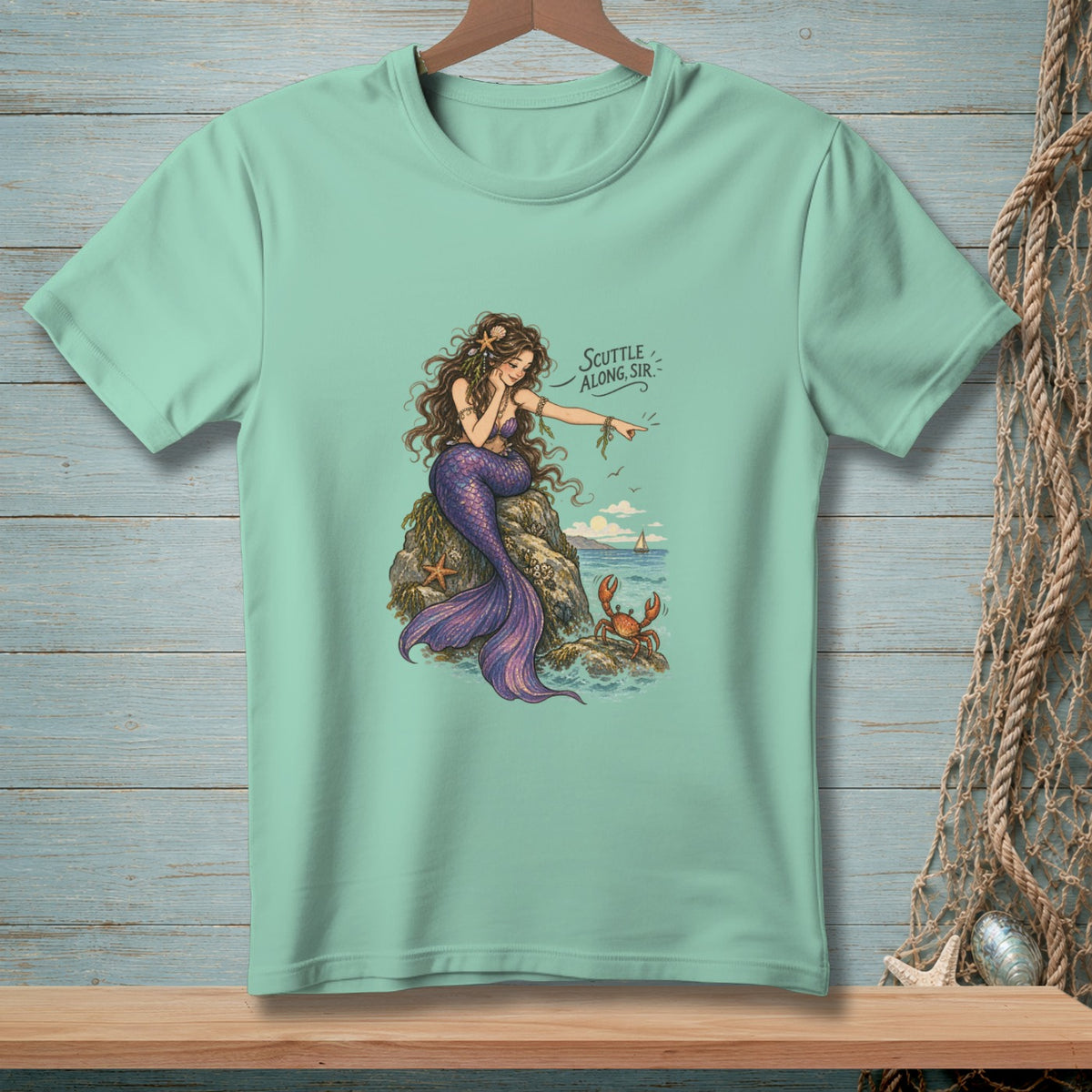 Mermaid on rock with crab and text "Scuttle along, Sir"
