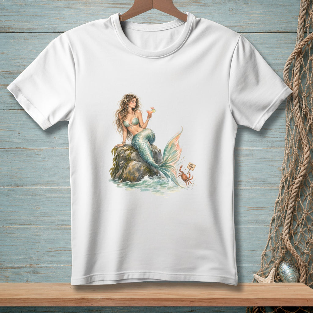 White t-shirt with watercolor print of a mermaid holding a cocktail and a crab with a "BE NICE" sign.