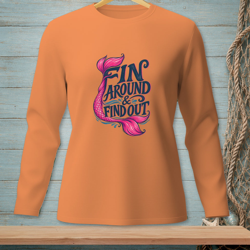 Orange long-sleeve shirt with "FIN AROUND & FIND OUT" and a mermaid tail graphic.