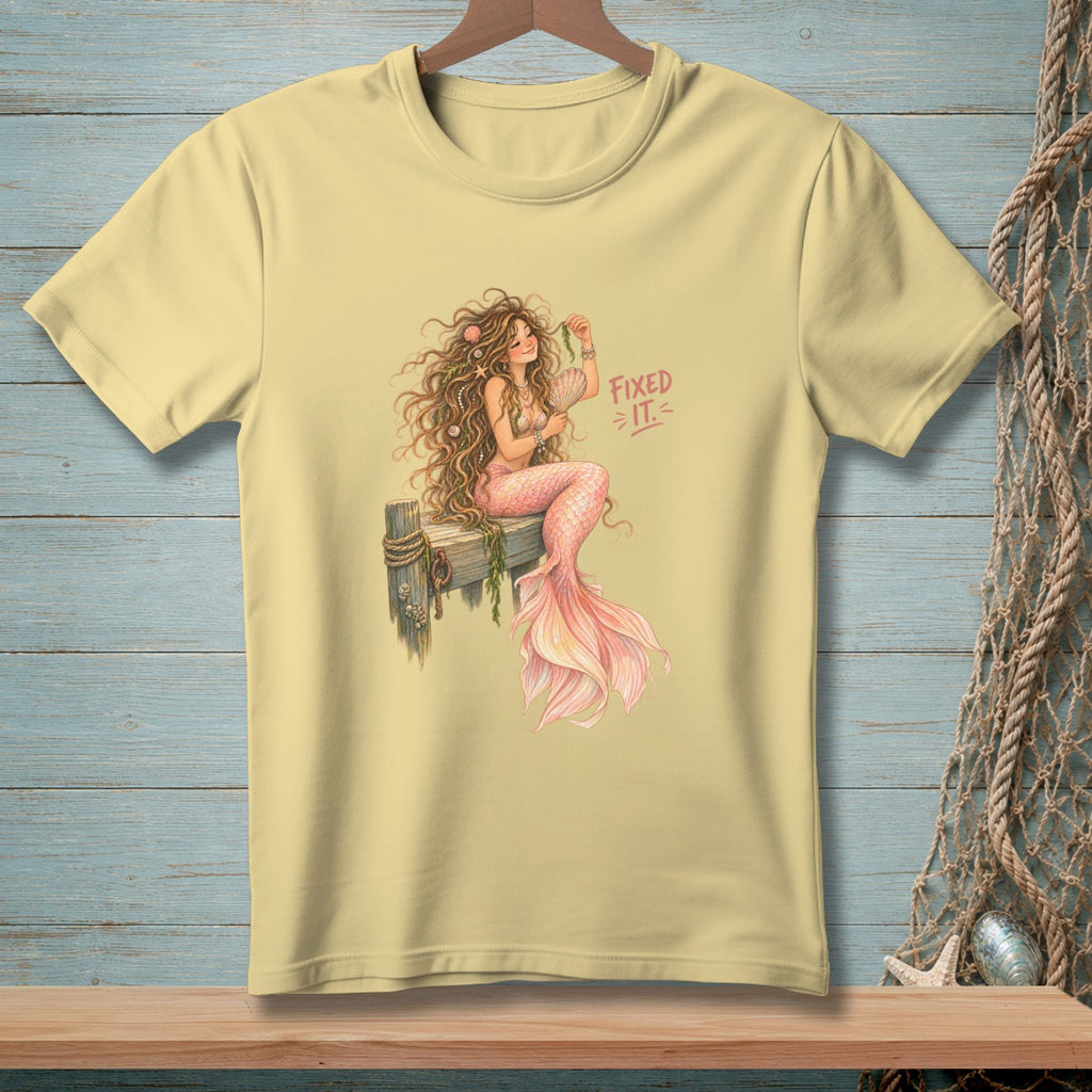 Yellow t-shirt with a watercolor illustration of a mermaid and "Fixed It" text.